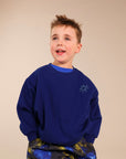 Blue jumper with contrast embrodiery