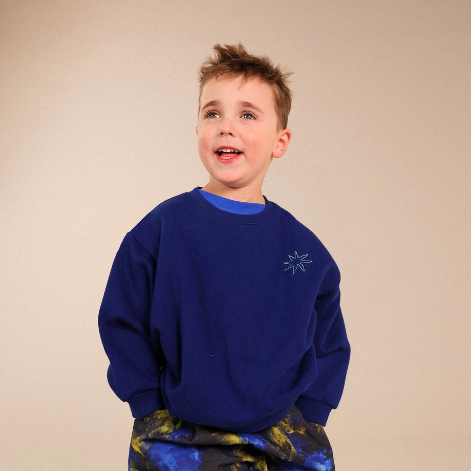 Blue jumper with contrast embrodiery